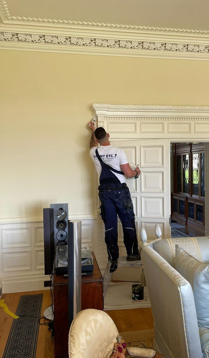a painter painting a wall